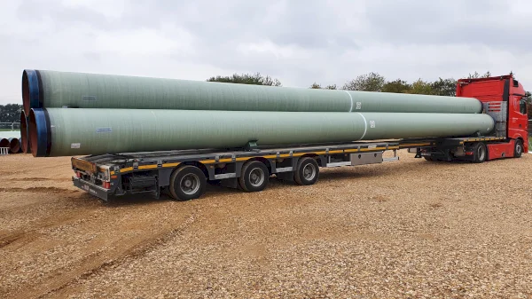 GRP coated pipes on a truck on route to a jobsite